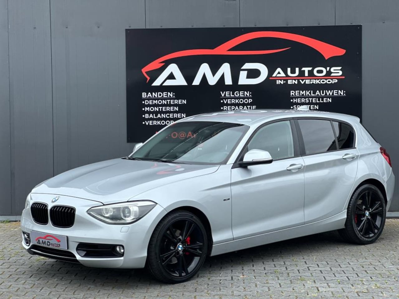 BMW 1-serie - 118i Business |Nap|Automaat|Cruise|Scherm|Climate Control|Elec Ramen| - AutoWereld.nl