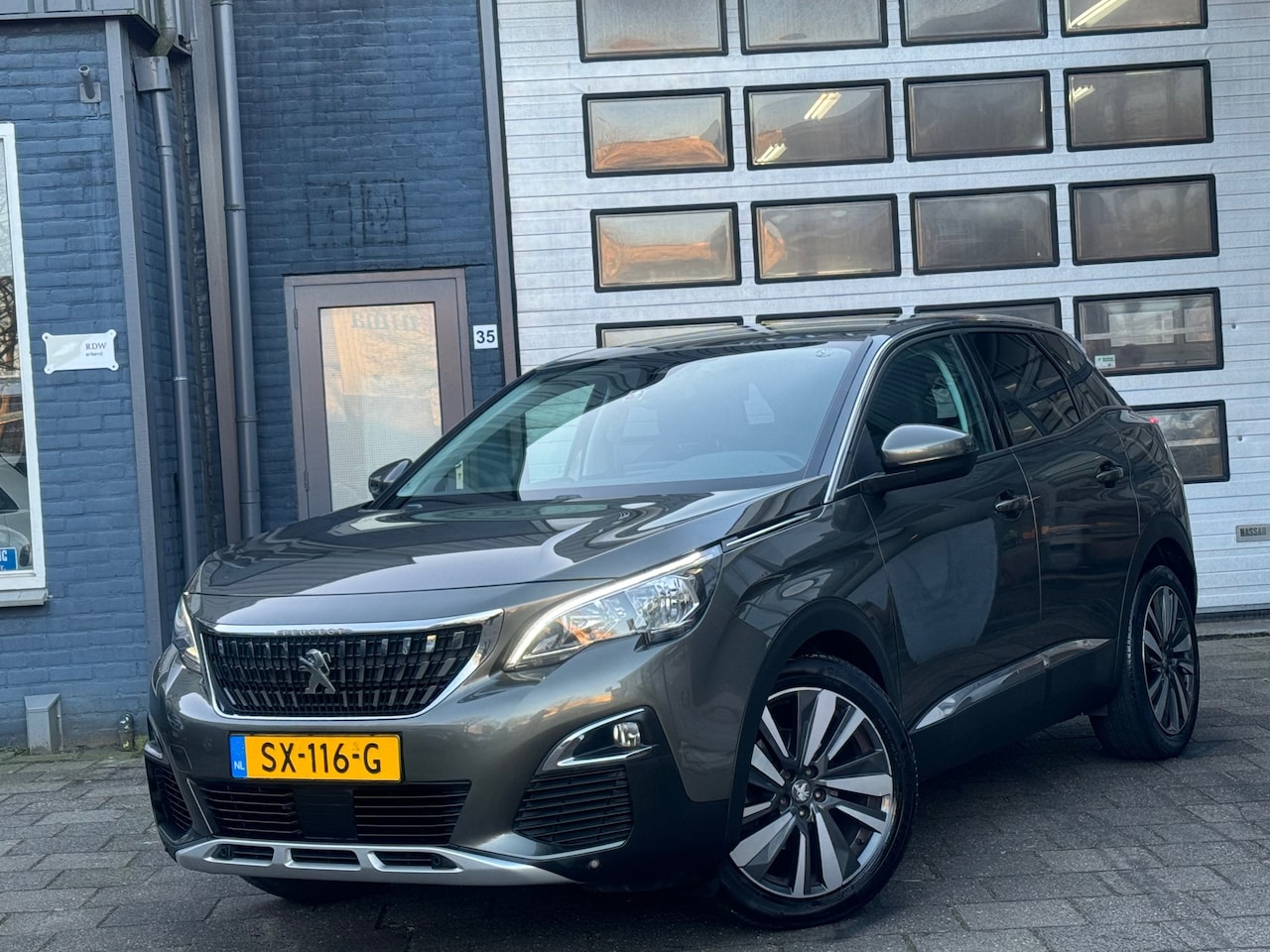 Peugeot 3008 - 1.2 PureTech Allure | Clima | Camera | Navi | N.A.P - AutoWereld.nl