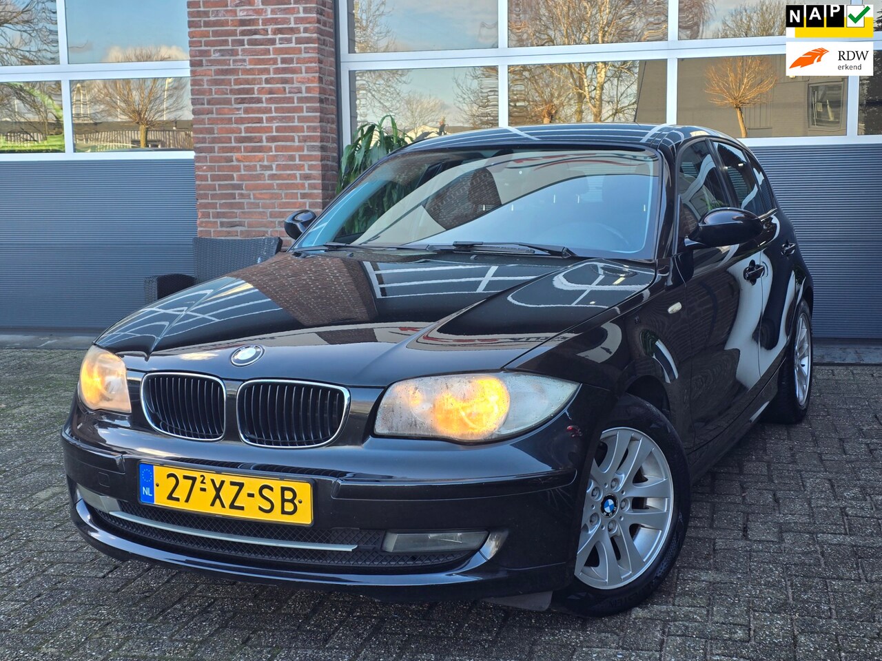 BMW 1-serie - 118i Business Line 5DR |Nap |Apk |Airco |Zwart - AutoWereld.nl