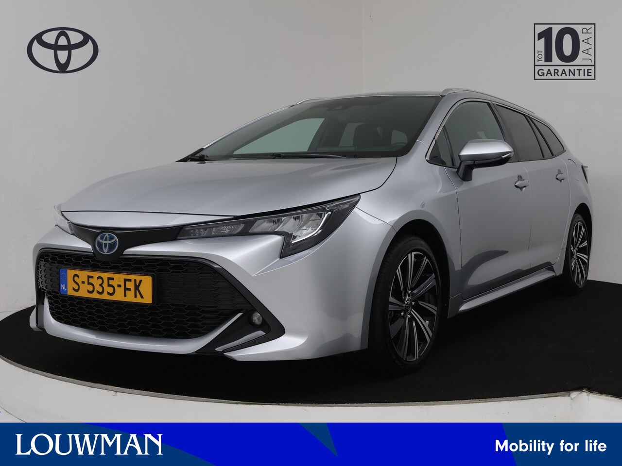 Toyota Corolla Touring Sports - 1.8 Hybrid Dynamic | Camera | Half leder | LM velgen | Stoelverwarming | Draadloze telefoo - AutoWereld.nl