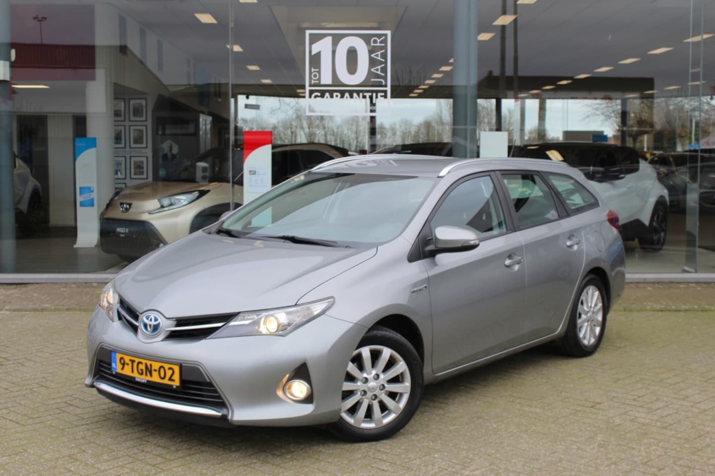 Toyota Auris Touring Sports - 1.8 Hybrid Aspiration | Trekhaak | Navi | Cruise Control | - AutoWereld.nl