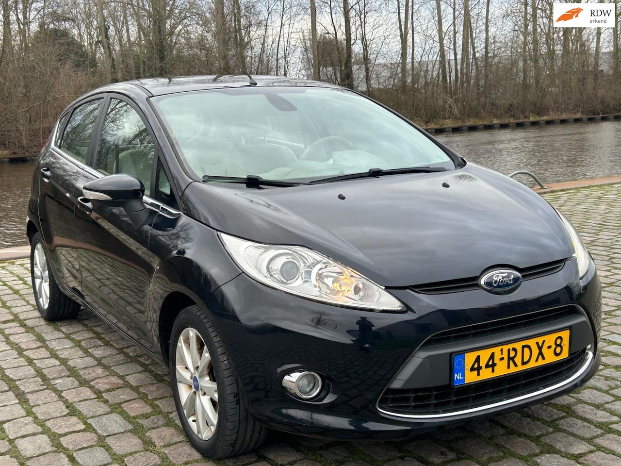 Ford Fiesta - 1.25 Ghia 1e eigenaar cruis control airco elektrische ramen cv op afs - AutoWereld.nl