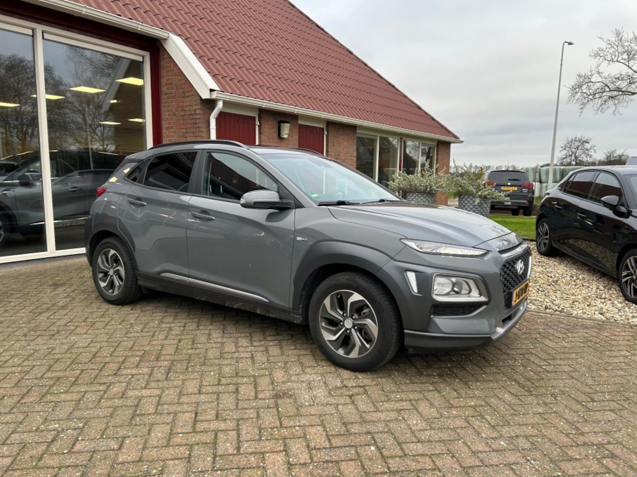 Hyundai Kona - 1.6 GDI HEV FASH SKY HYBRID AUTOMAAT TREKHAAK - AutoWereld.nl