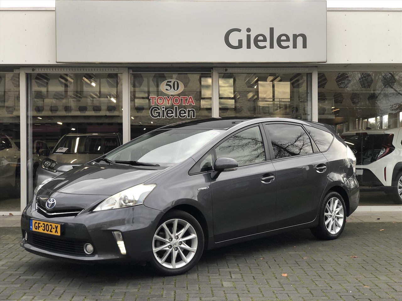 Toyota Prius - 1.8 Hybrid Aspiration | Panoramadak, Fietsendragerbeugel, Navigatie, Parkeercamera, Cruise - AutoWereld.nl