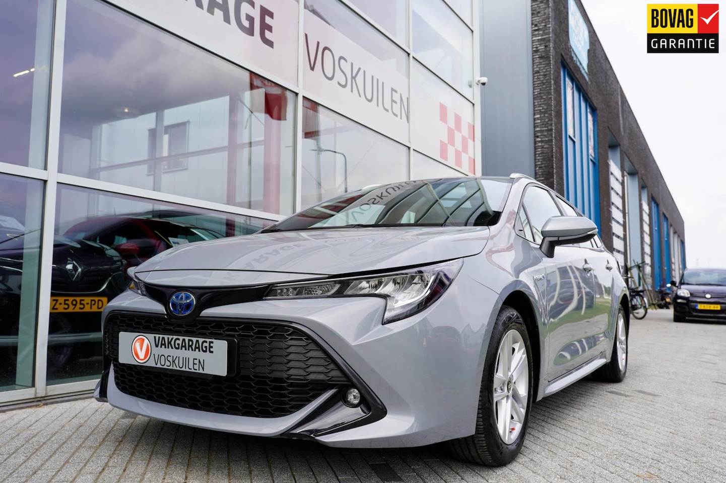 Toyota Corolla Touring Sports - 1.8 Hybrid Business | Navi | Carplay| Sensoren | Camera - AutoWereld.nl