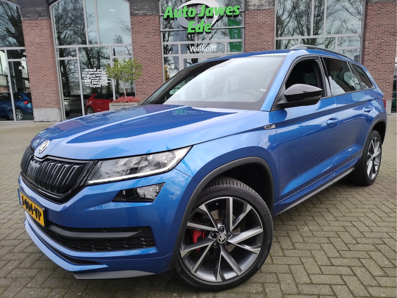 Skoda Kodiaq - 1.5 TSI DSG Sportline Business Afn.trekhaak - 20Inch LMV - Canton Audio - Blindspot detect - AutoWereld.nl