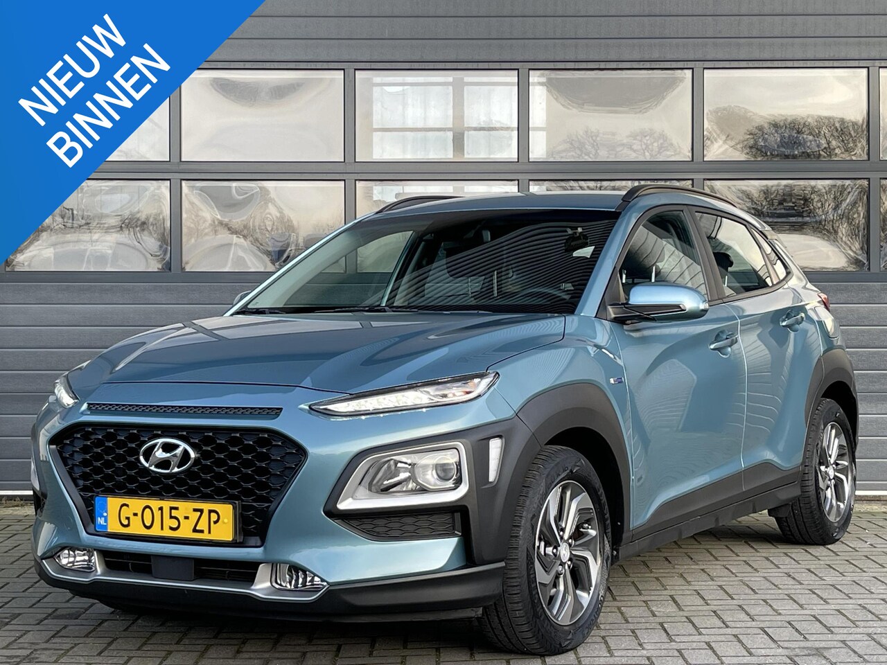 Hyundai Kona - 1.6 GDI HEV COMFORT I AUTOMAAT I ACHTERUITRIJCAMERA I APPLE/ANDROID I DEALER ONDERHOUDEN - AutoWereld.nl