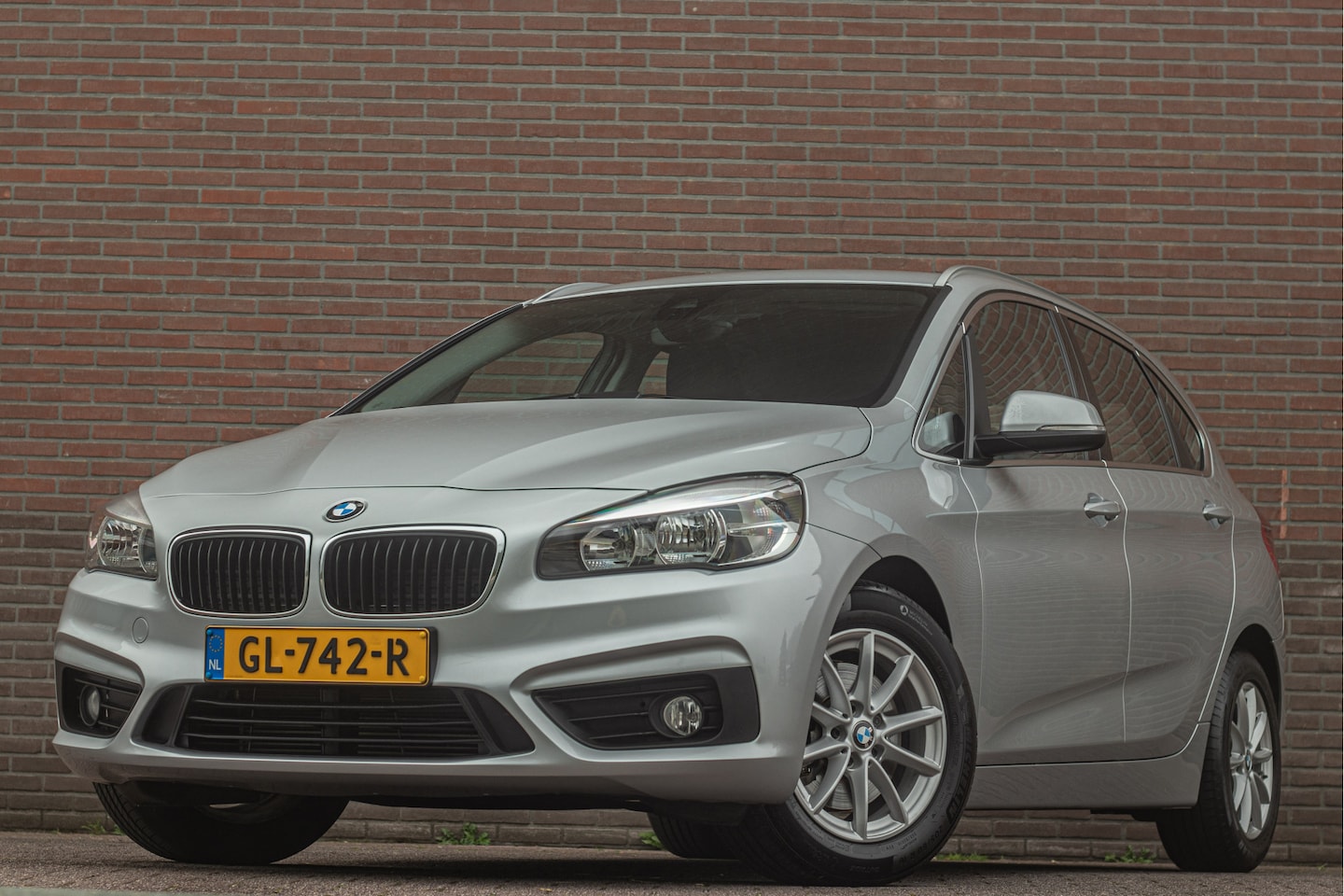 BMW 2-serie Active Tourer - 218i Essential 218i Essential, 79.000km NAP, Navigatie, Trekhaak, PDC, Bluetooth, Climate control. - AutoWereld.nl