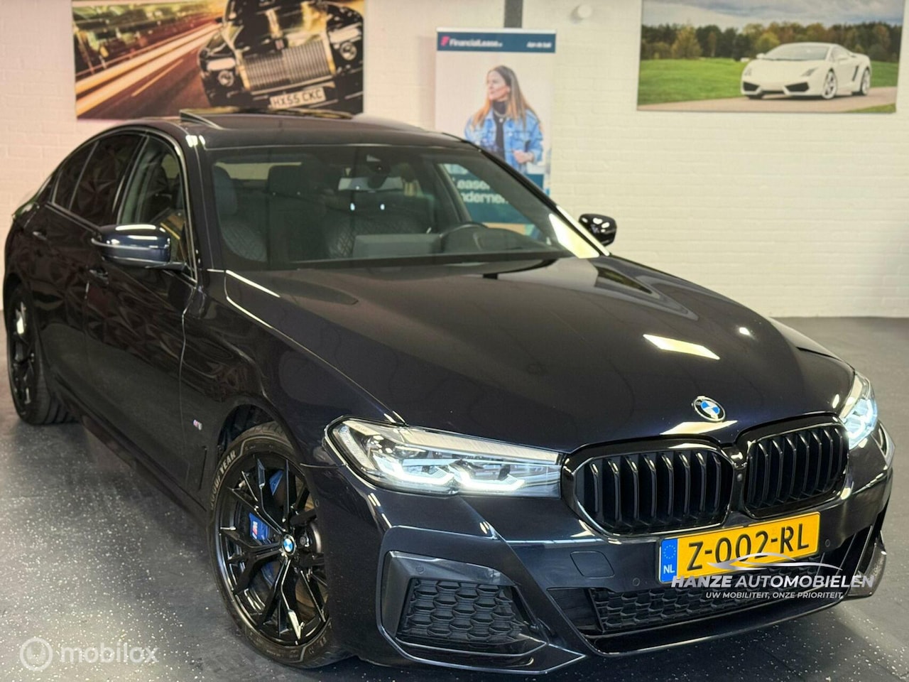 BMW 5-serie - 545e xDrive High Executive M PANO HUD - AutoWereld.nl