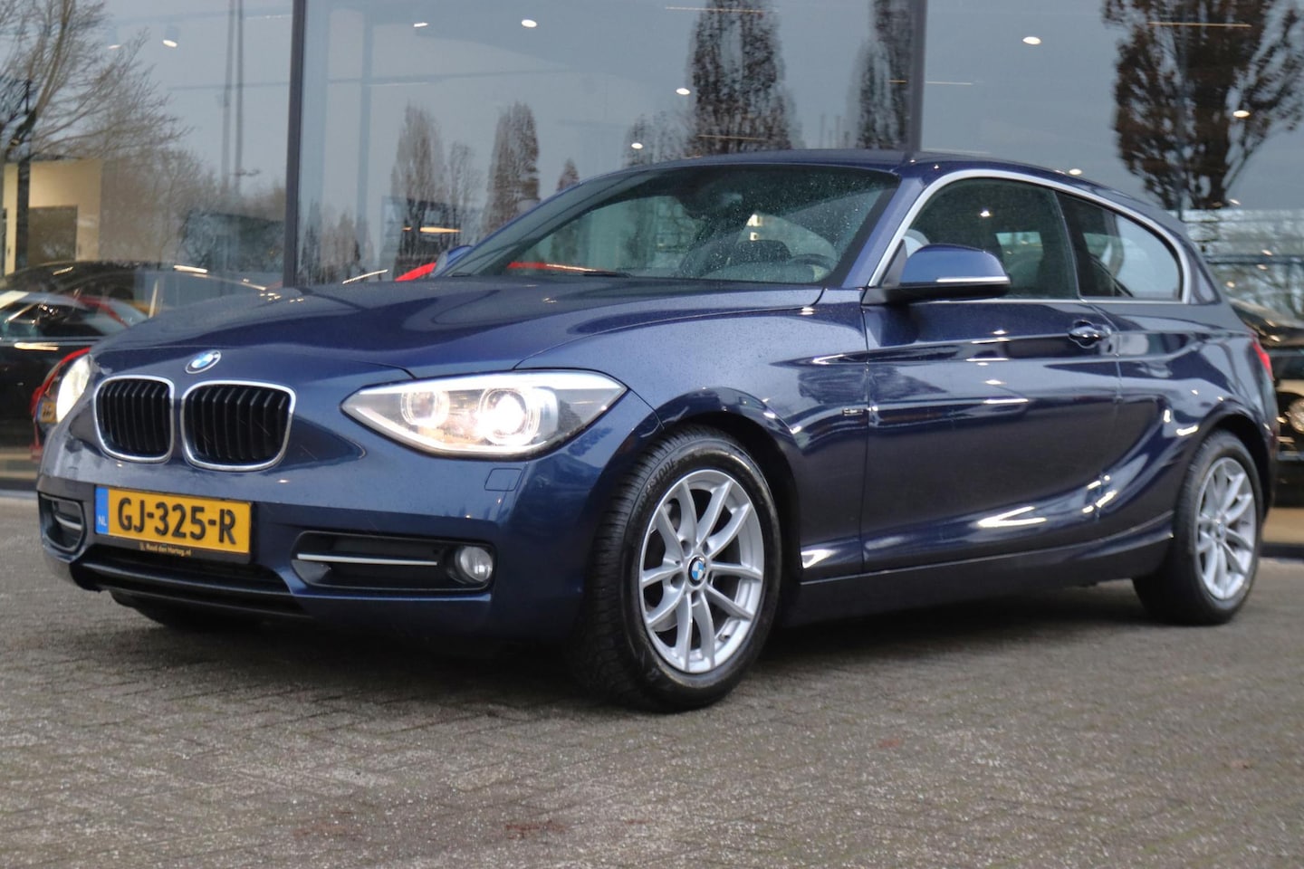 BMW 1-serie - 116D EDE EXECUTIVE | XENON | CRUISE | BLUETOOTH | CLIMATE | NAVI | LMV - AutoWereld.nl