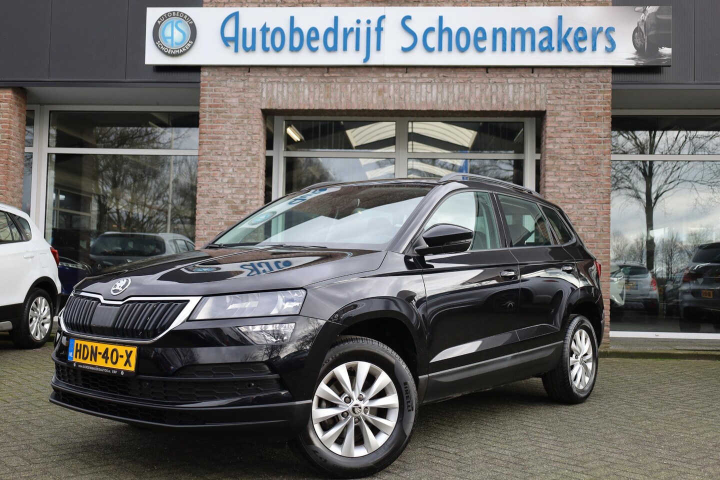 Skoda Karoq - 1.0 TSI Business Edition Plus CAMERA DAB NAVI STOELVERW. SFEERVERLICHTING CARPLAY 2xPDC CR - AutoWereld.nl