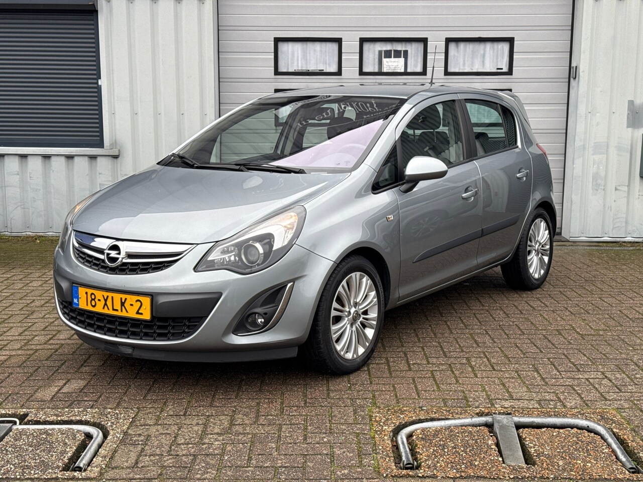 Opel Corsa - 1.4-16V Cosmo Navi | Stoel-/stuurverw. | Fietsendrager | PDC | Cruise - AutoWereld.nl