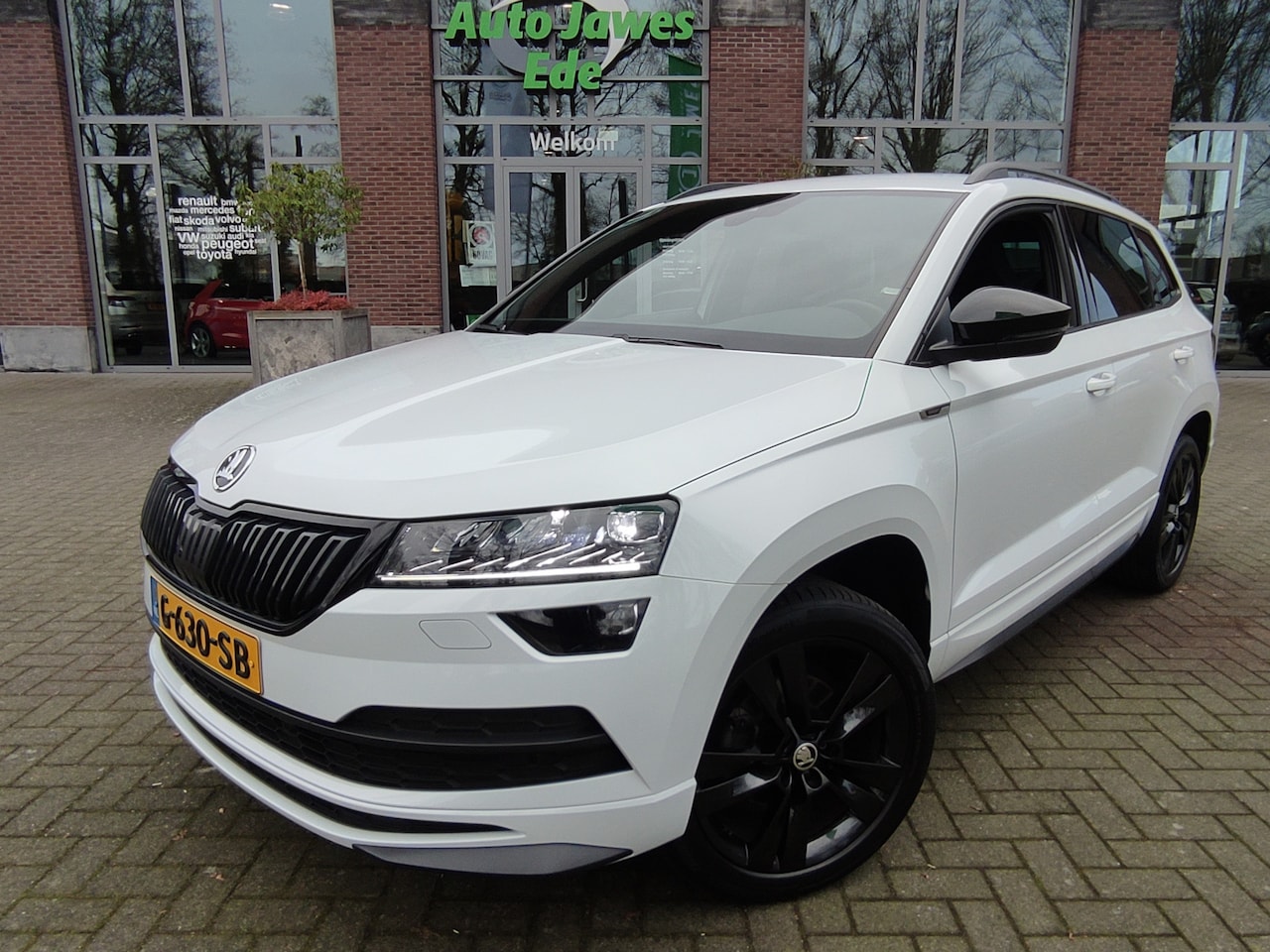 Skoda Karoq - 1.5 TSI DSG ACT Sportline Business Wegklapbare trekhaak - Adaptieve cruise control - Premi - AutoWereld.nl