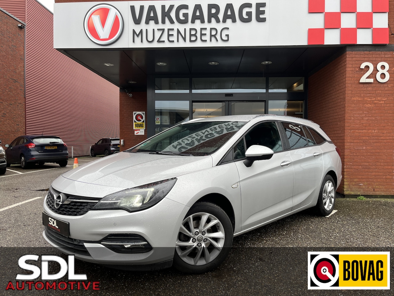 Opel Astra Sports Tourer - 1.2 Business Edition 146PK!! // CAMERA+SENSOREN // CRUISE // NAVI+CARPLAY // STUUR+STOELVE - AutoWereld.nl