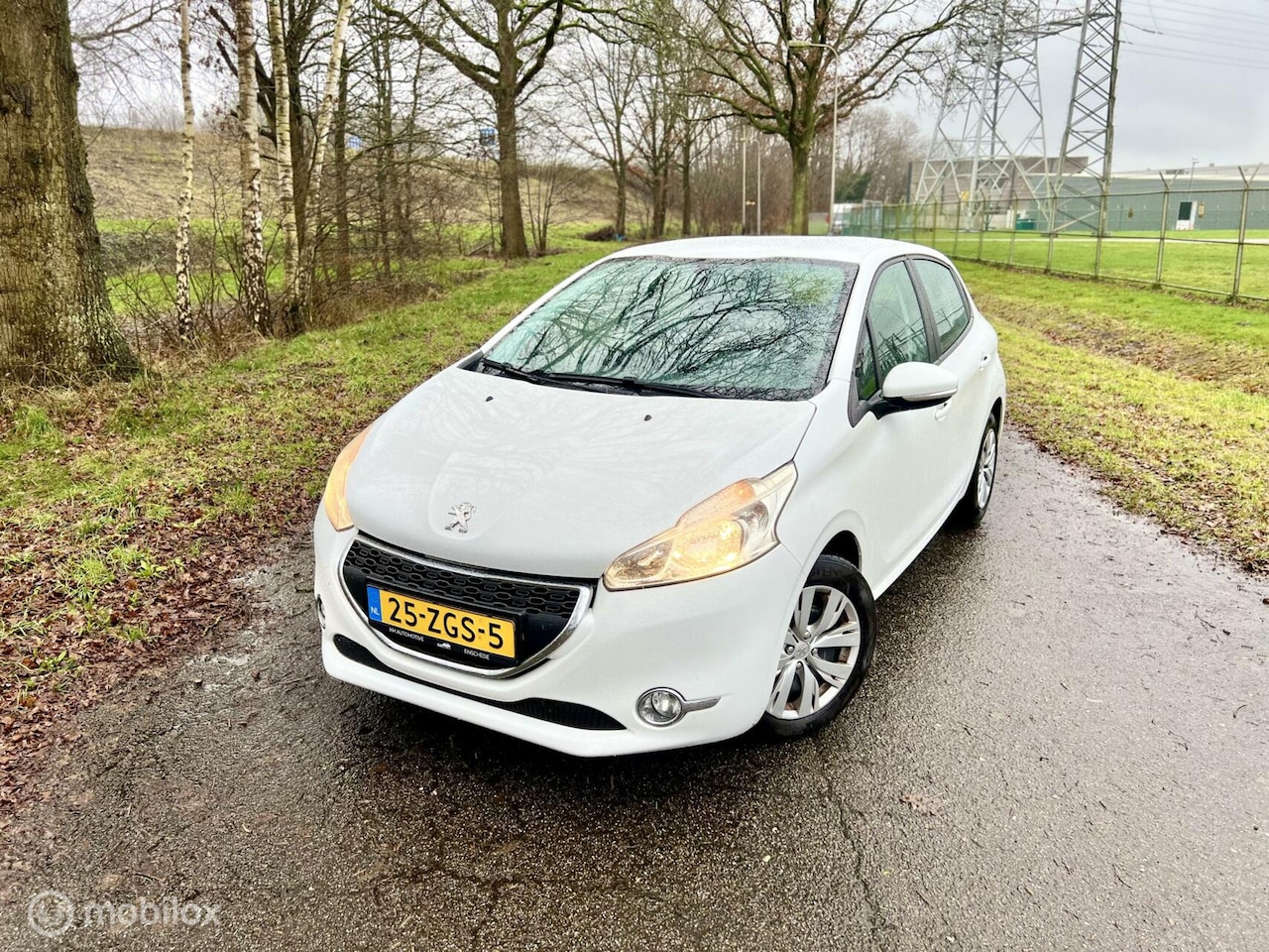 Peugeot 208 - 1.2 VTi Wit 5drs PDC Airco Touchscreen NAP ✅ - AutoWereld.nl