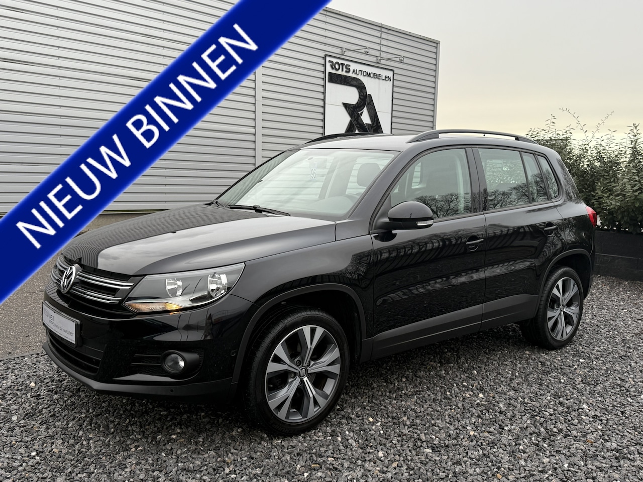 Volkswagen Tiguan - 1.4 TSI Comfort&Design PDC|Carplay|Cruis Zwart! - AutoWereld.nl