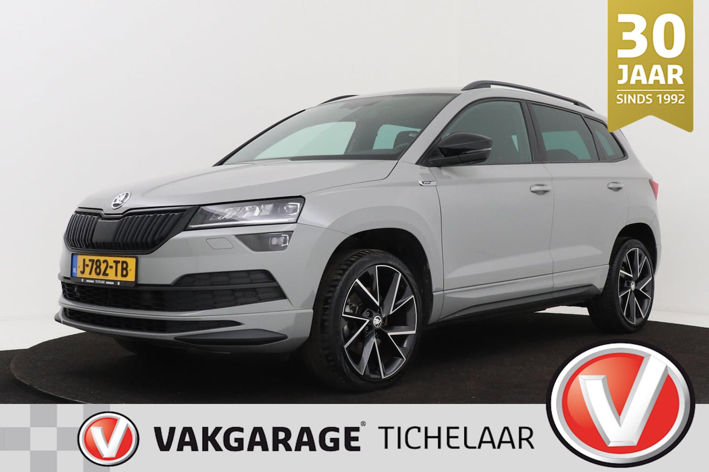 Skoda Karoq - 1.5 TSI Sportline Business | Uitklap Trekhaak | Org NL | Digital Cockpit | CarPlay | Stoel - AutoWereld.nl