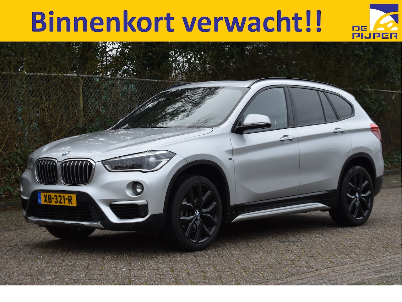 BMW X1 - sDrive20i Orange Edition II Open dak |  Cruise control | Navi |  Trekhaak | - AutoWereld.nl