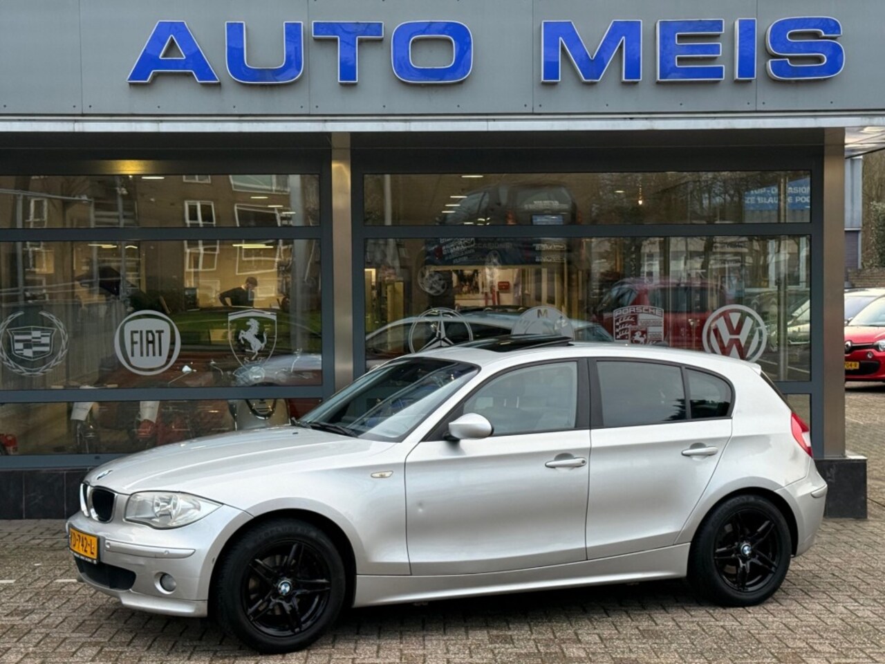 BMW 1-serie - 116I High Executive Schuifdak Navi Clima Cruise PDC - AutoWereld.nl