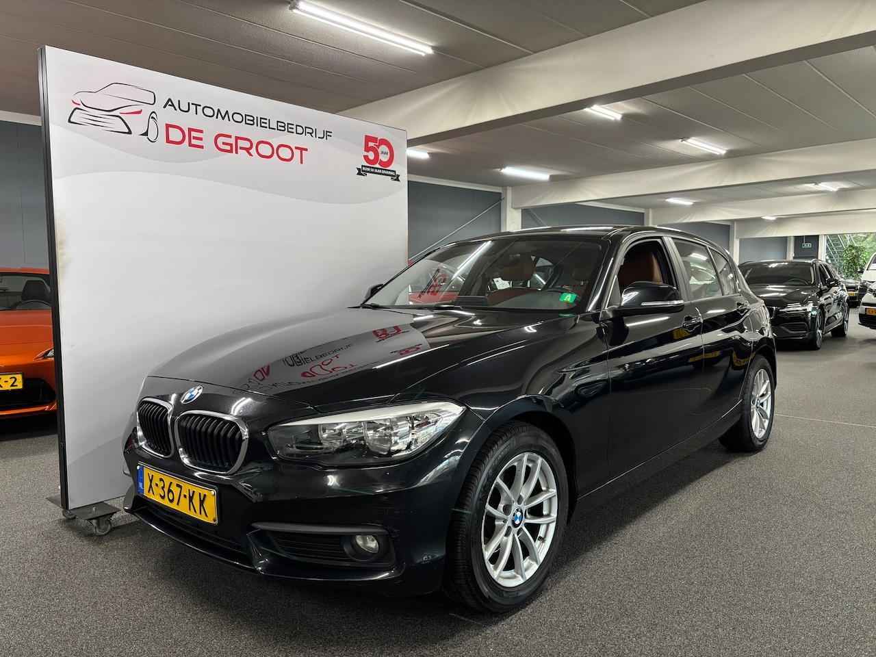 BMW 1-serie - 118i High Executive / Automaat, Navi, Bluetooth - AutoWereld.nl