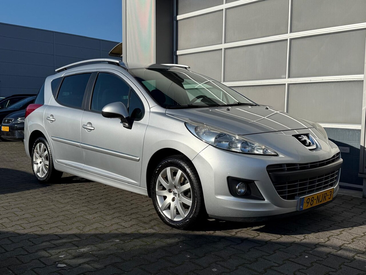 Peugeot 207 SW - 1.6 VTi Sportium|Trekhaak|Cruise|Airco|PDC|Aux - AutoWereld.nl