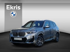 BMW X1 - sDrive18i M Sportpakket | Premium Pack | Travel Pack | Glazen panoramadak | High-beam assi