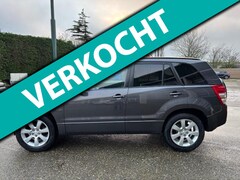 Suzuki Grand Vitara - 2.4 High Executive Aut/ AWD/Schuifdak/Leer/Trekhaak/Navi/PDC