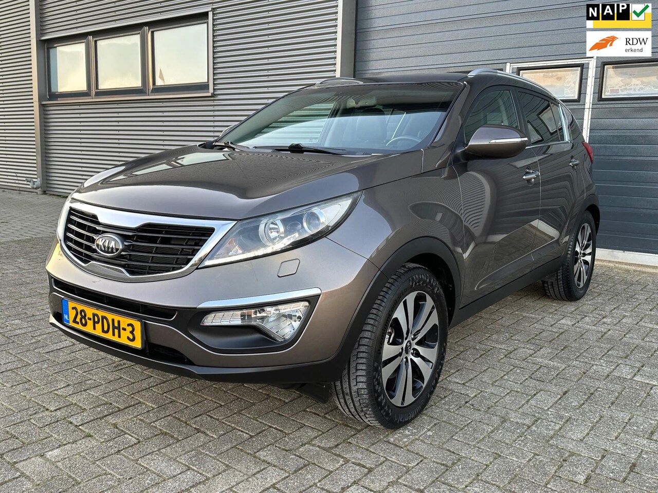 Kia Sportage - 2.0 X-clusive - 1STE EIGENAAR - NAVI - TREKHAAK - CLIMA. - AutoWereld.nl