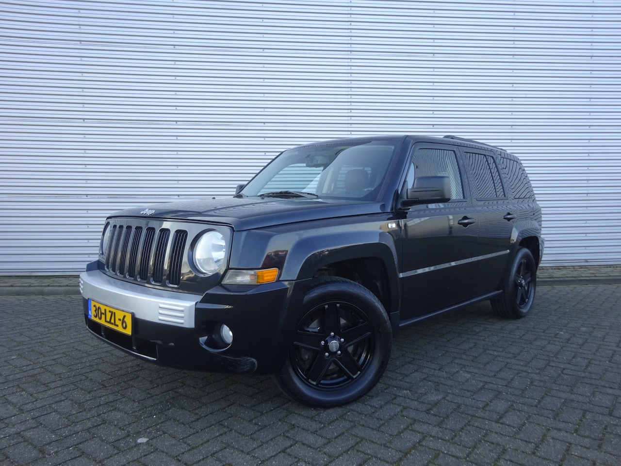 Jeep Patriot - 2.4 Sport Liberty Airco / Stoelverw. / Cruise / Trekhaak / NAP - AutoWereld.nl