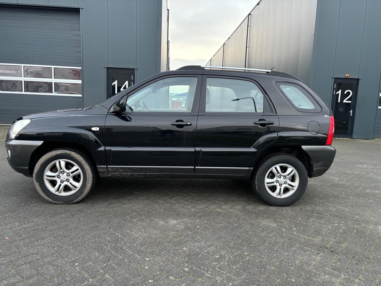 Kia Sportage - 2.0 CVVT Executive 2.0 CVVT Executive - AutoWereld.nl