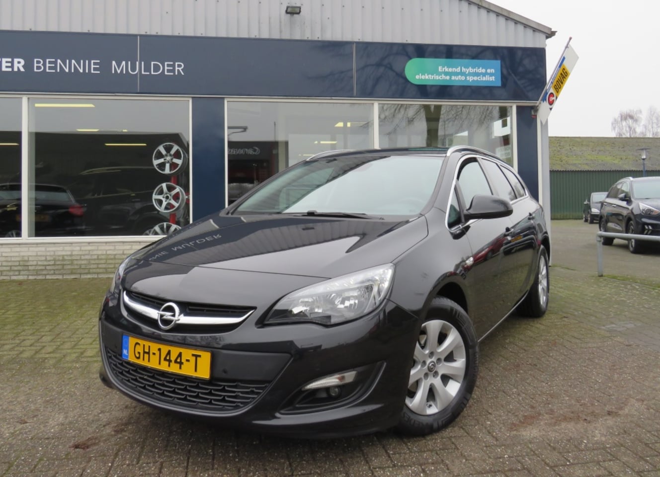 Opel Astra Sports Tourer - 1.4 Turbo NAVI / AIRCO / TREKHAAK - AutoWereld.nl