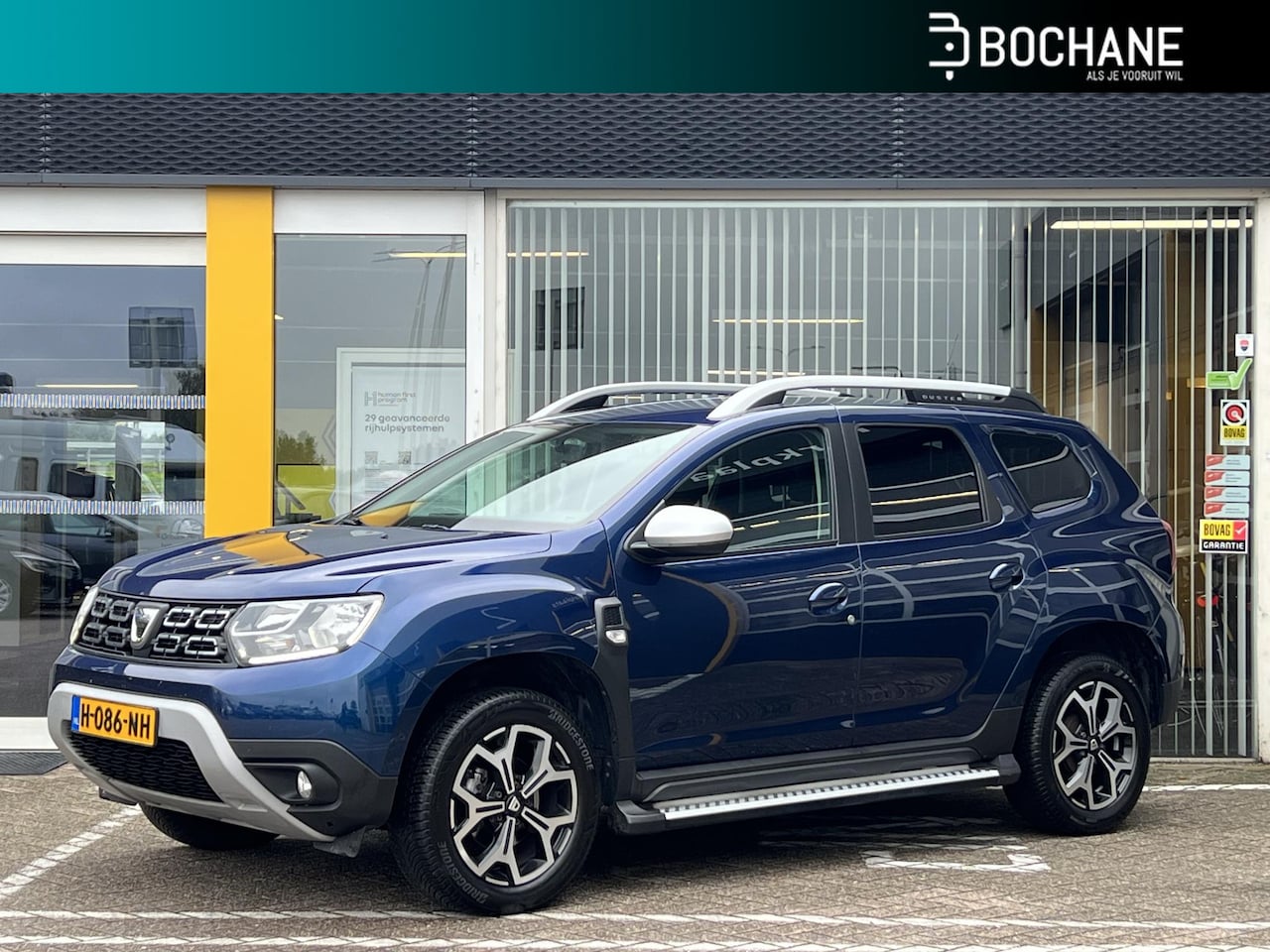 Dacia Duster - 1.3 TCe 130 Prestige | Navigatie | All-Season banden | Trekhaak | Parkeersensoren | Cruise - AutoWereld.nl