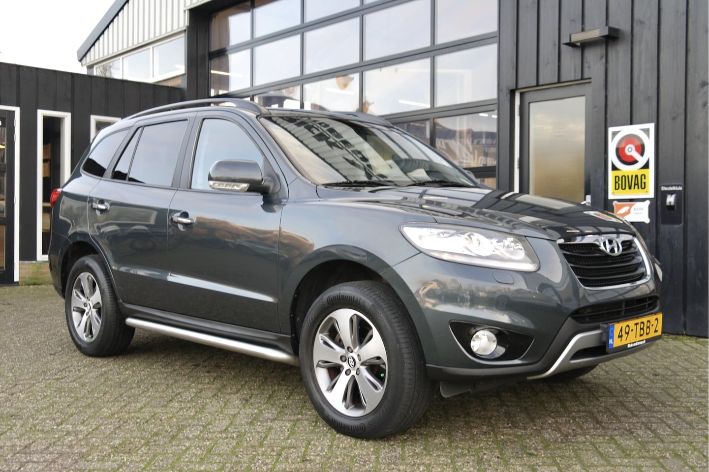 Hyundai Santa Fe - 2.4i CVVT 4WD Style 7 pers. Automaat | NL-Auto | Trekhaak | Cruise | Camera - AutoWereld.nl