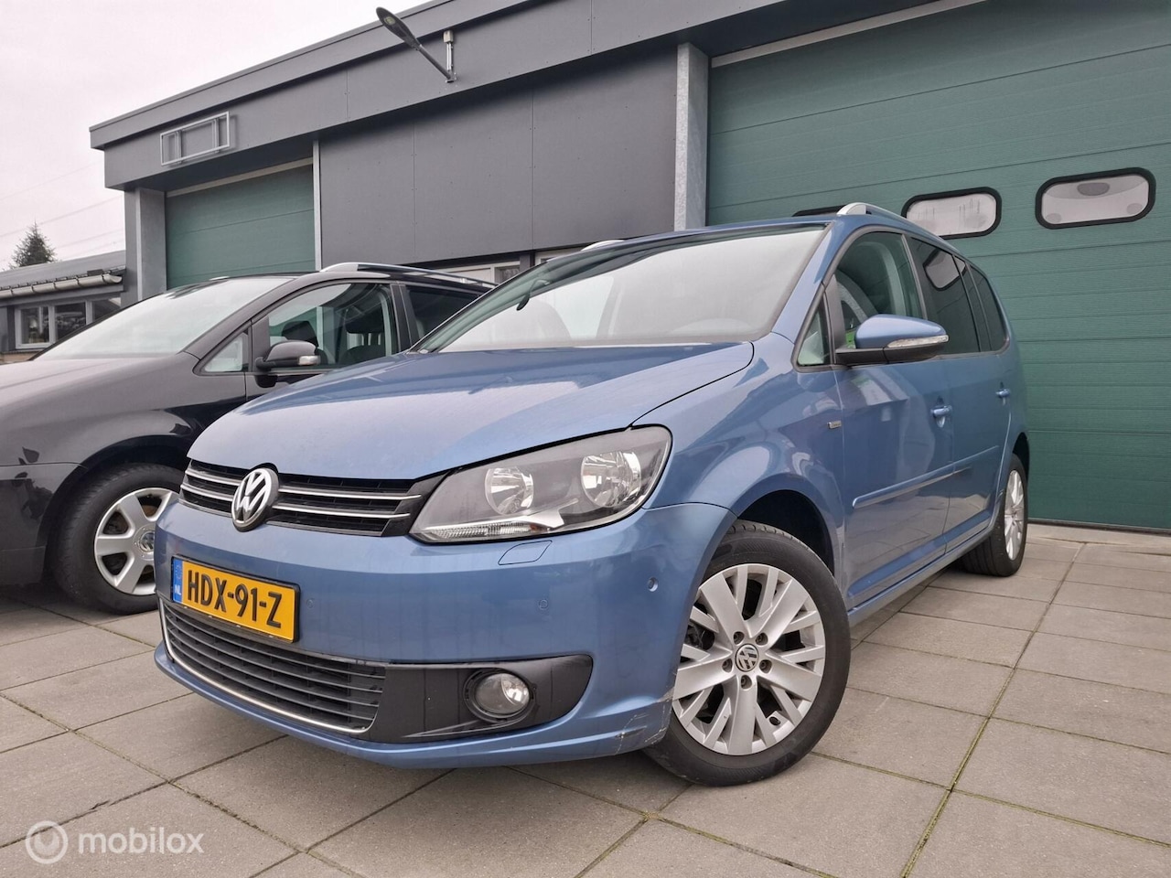 Volkswagen Touran - 1.4 TSI Highline automaat/7p./navi/pdc - AutoWereld.nl