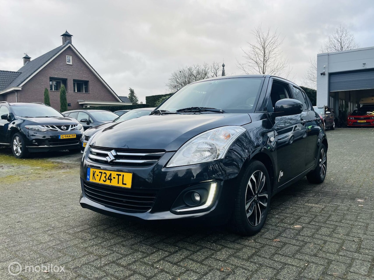 Suzuki Swift - 1.2 Bandit EASSS 5 drs / Cruise / Audio / LM / Stoelverwarming - AutoWereld.nl