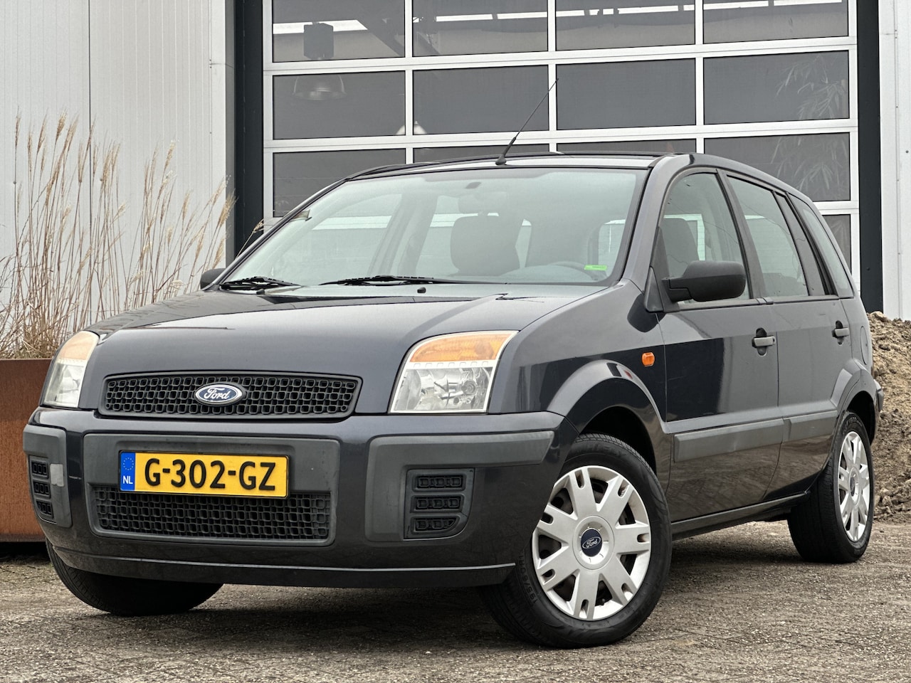 Ford Fusion - 1.4-16V Cool & Sound 81pk | Hoge instap | Airco | Elek. ramen | Voorruit verwarming | Radi - AutoWereld.nl