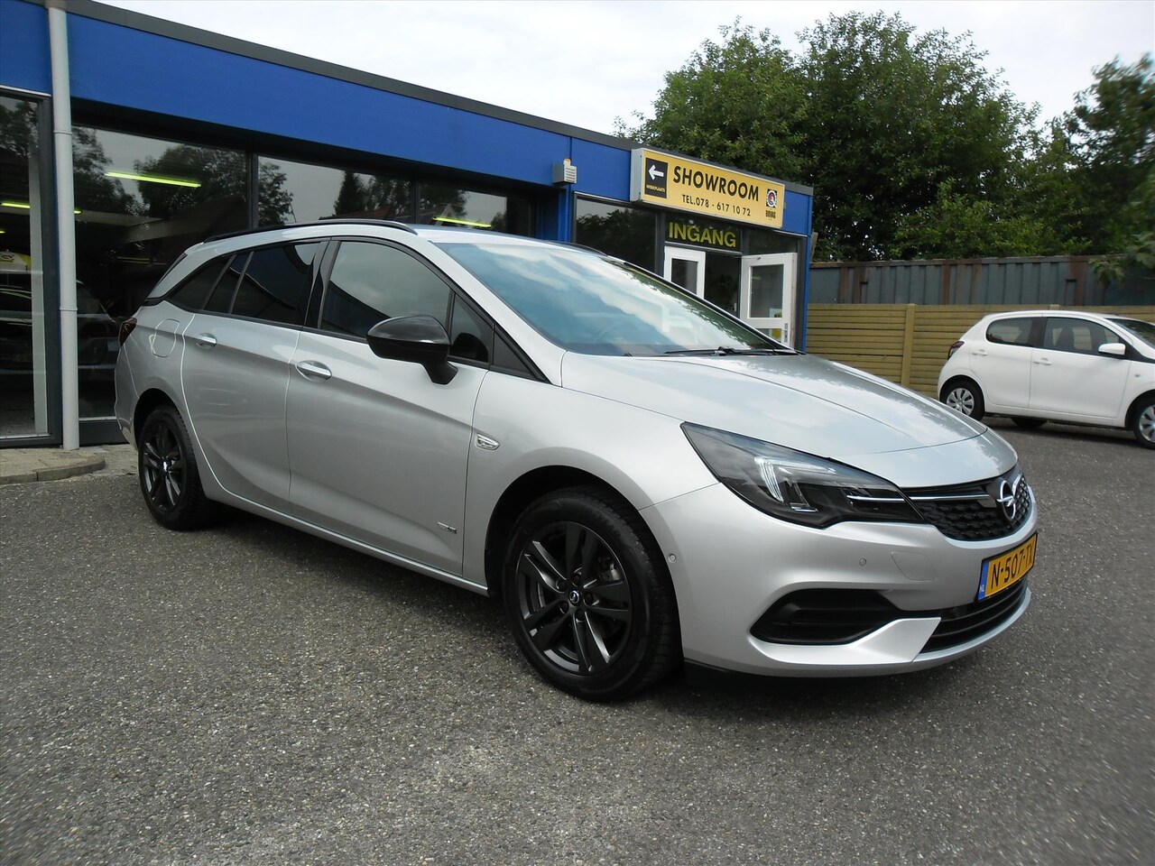 Opel Astra Sports Tourer - 1.2 T 110PK DESIGN ED NAV ECC 1/2 LEDER LMV CAMERA PDC XENON RIJKLAARPRIJS - AutoWereld.nl