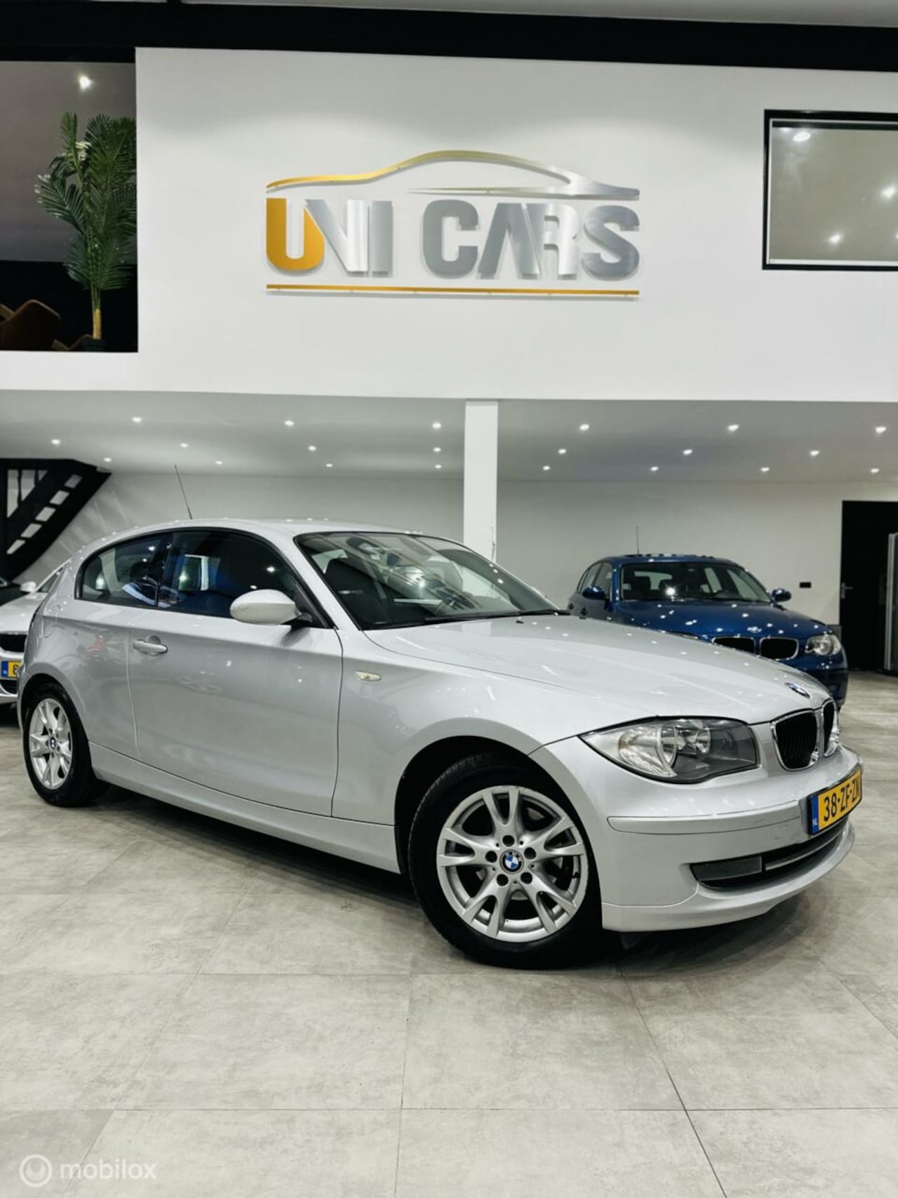 BMW 1-serie - 116i Executive|Nap|Navi|Cruise|Clima|Trekhaak| - AutoWereld.nl