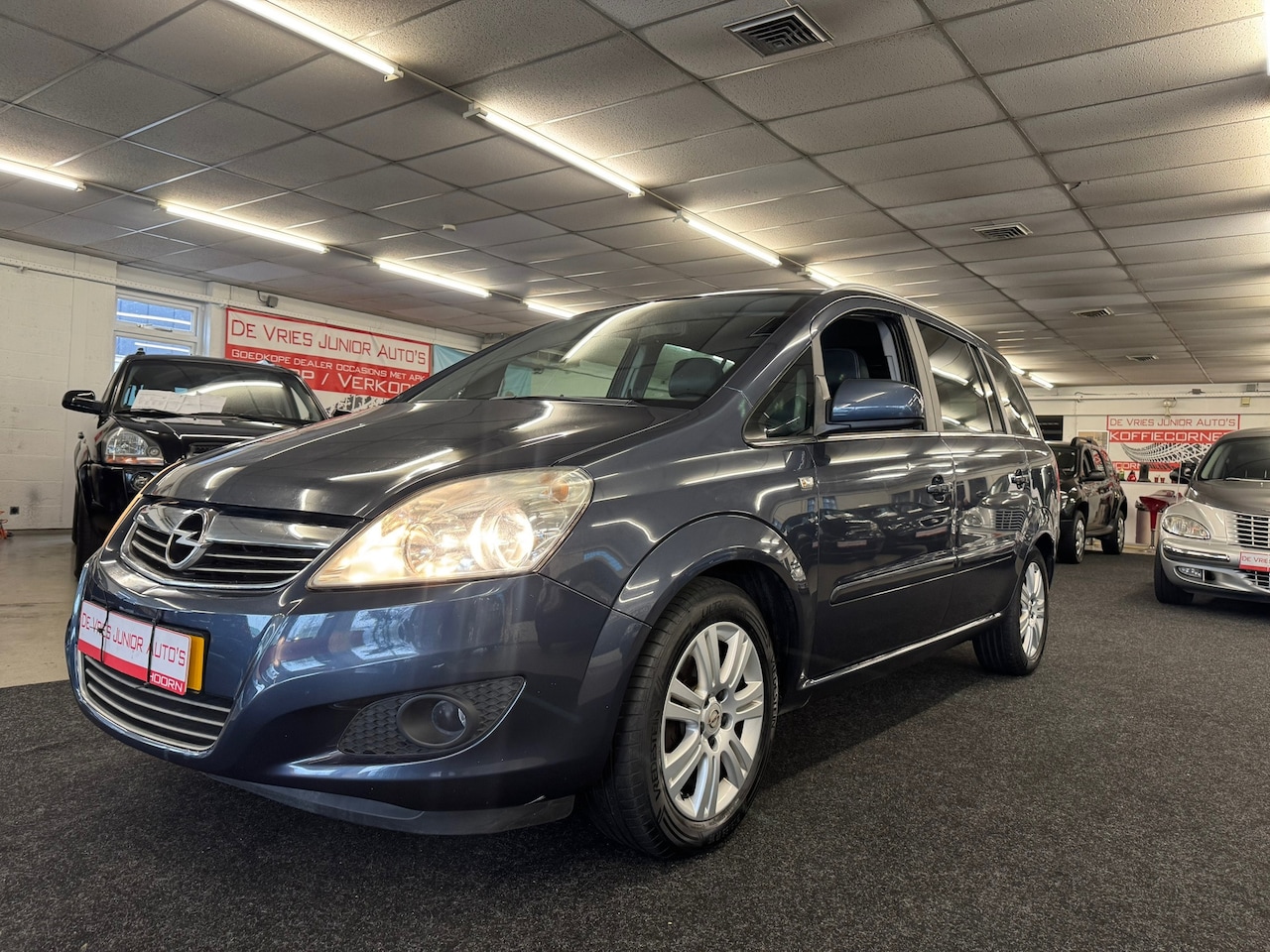 Opel Zafira - 1.6 Cosmo. Dealer onderhouden, 7-pers, Cruise control met trekhaak - AutoWereld.nl