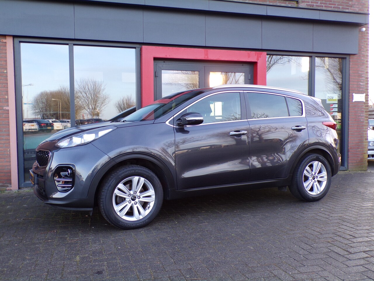 Kia Sportage - 1.6 GDI Design Edition Navi PDC Leer Trekhaak NAP - AutoWereld.nl