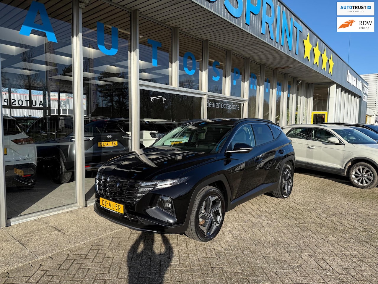 Hyundai Tucson - 1.6 T-GDI PHEV Premium 4WD 265PK / NAVIGATIE / ACHTERUITRIJCAMERA - AutoWereld.nl