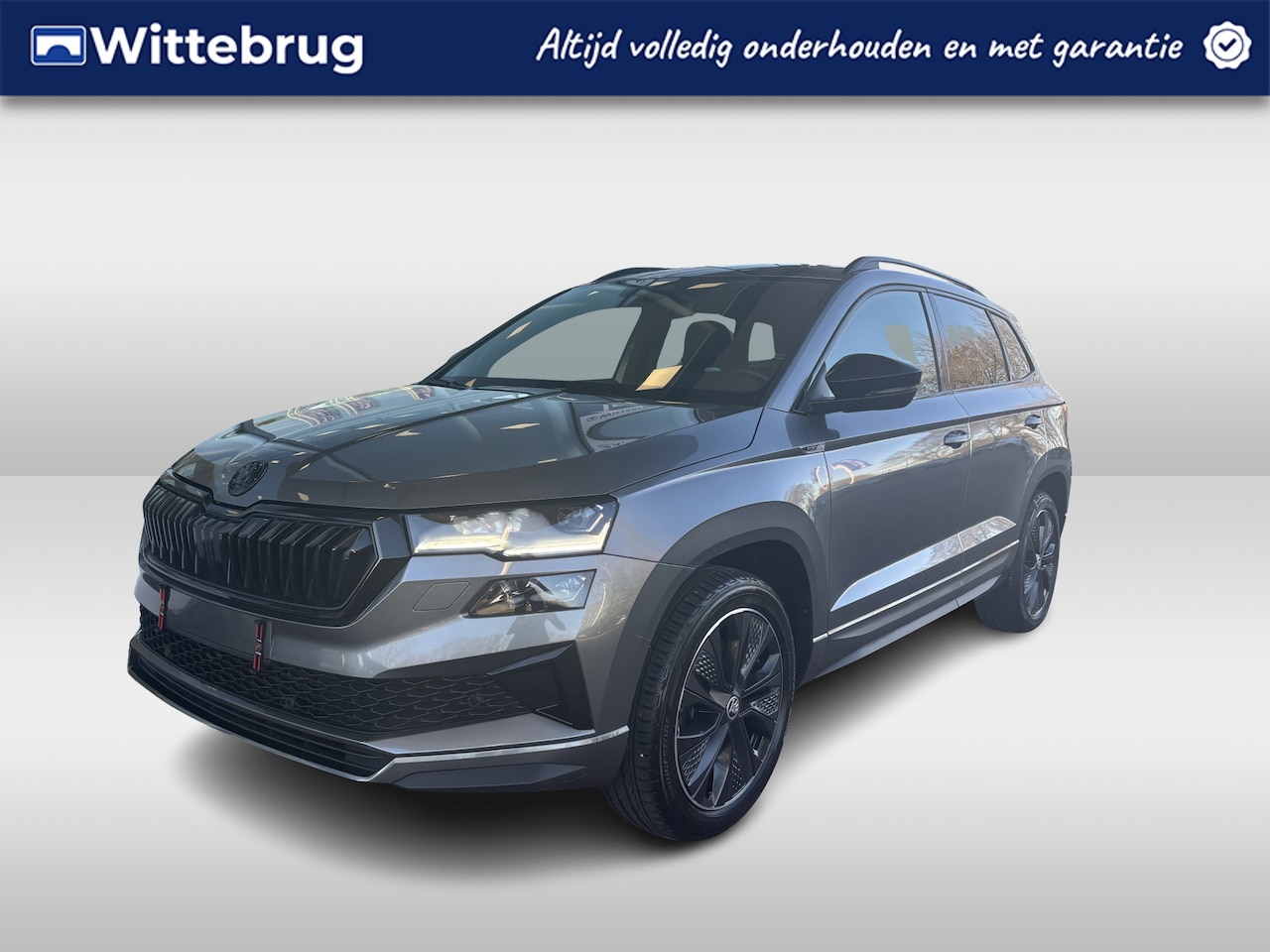 Skoda Karoq - 1.5 TSI ACT Sportline Business / Afneembare trekhaak / Achteruitrijcamera / 18" lichtmetal - AutoWereld.nl