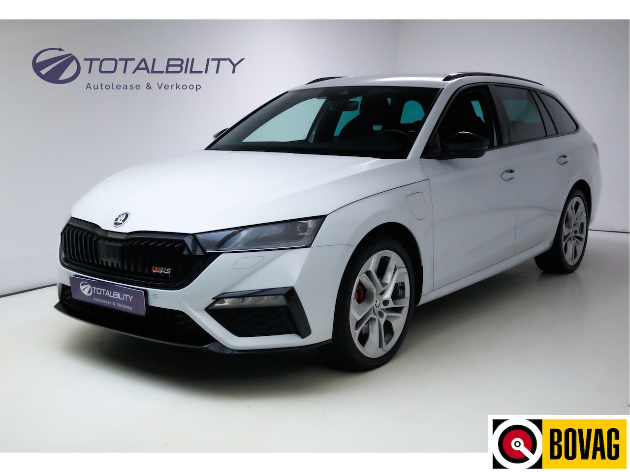 Skoda Octavia Combi - 1.4 TSI RS iV PHEV Business 245 PK Stoelverwarming, Smartlink, 19" Lichtmetalen velgen, Pa - AutoWereld.nl