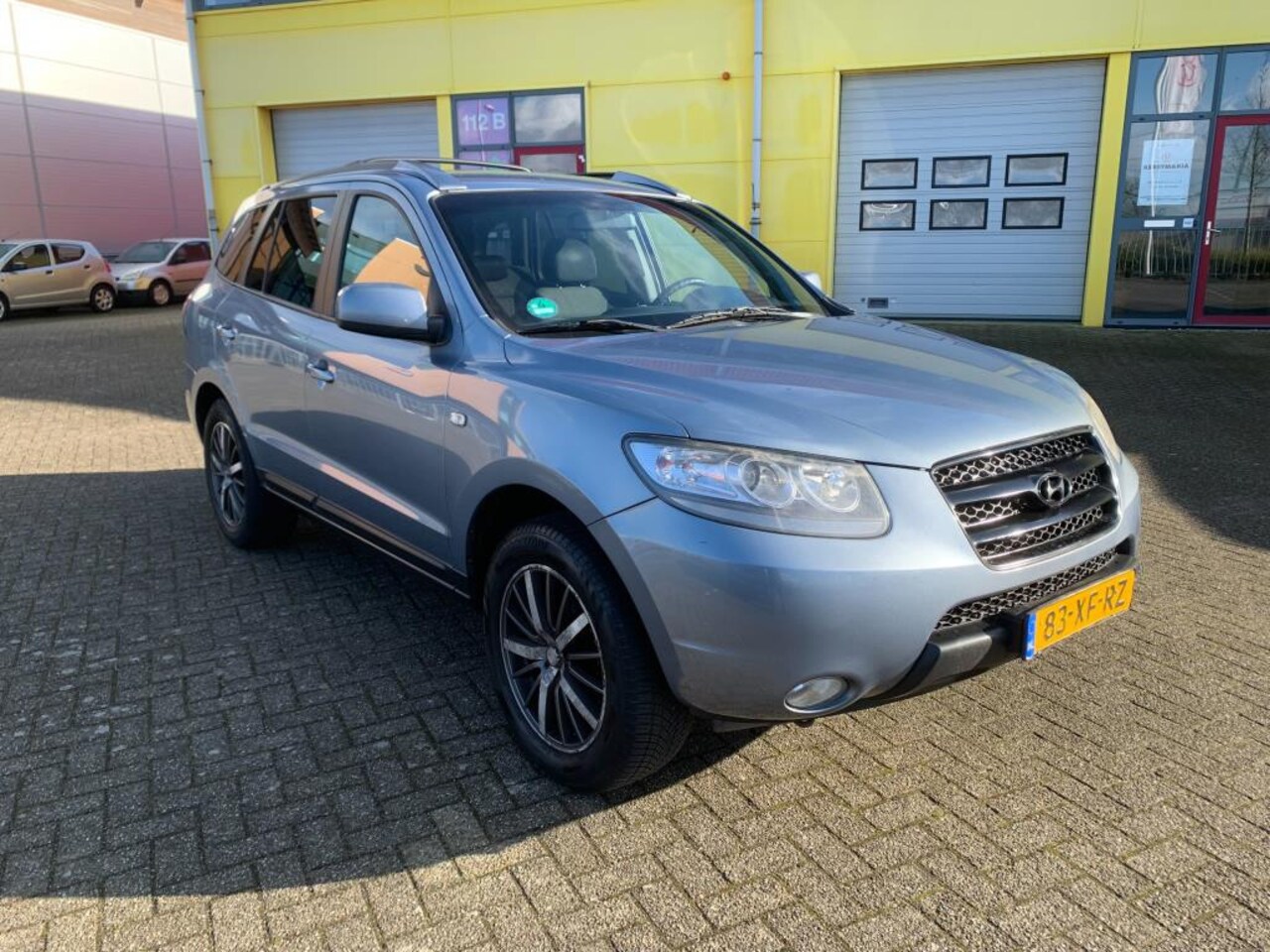 Hyundai Santa Fe - 2.7i V6 Dynamic 7p. Blauw Airco Cruise Navi - AutoWereld.nl