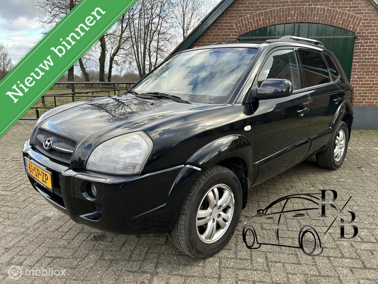 Hyundai Tucson - 2.0i Style INRUILKOOPJE MET APK/ LICHTE SCHADE - AutoWereld.nl