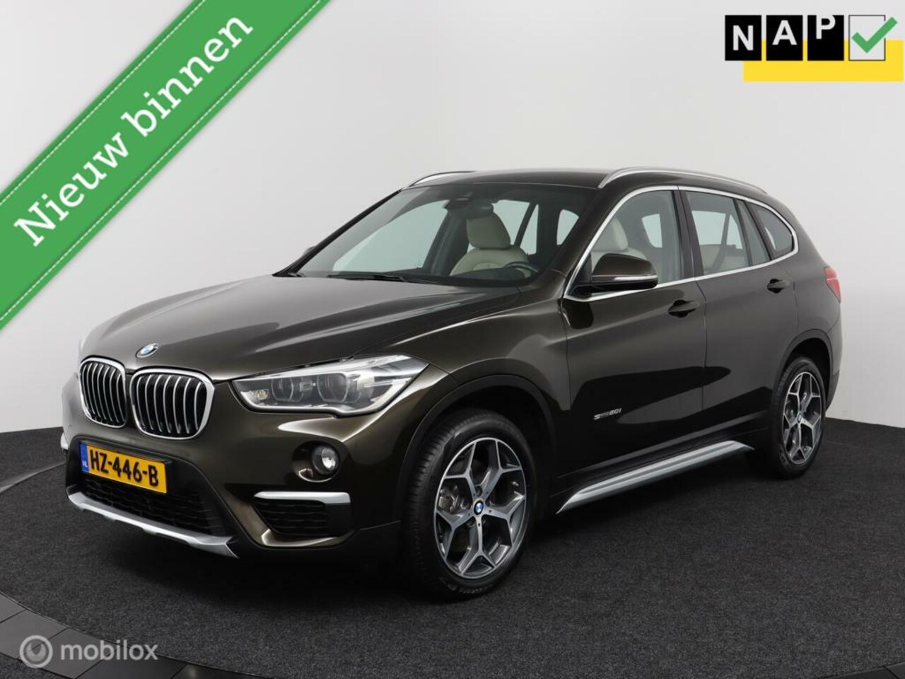 BMW X1 - SDrive 2.0i 192Pk Aut-8 | Clima | Leder | Cruise | Head-up display | Stoelverw. | Xenon | - AutoWereld.nl