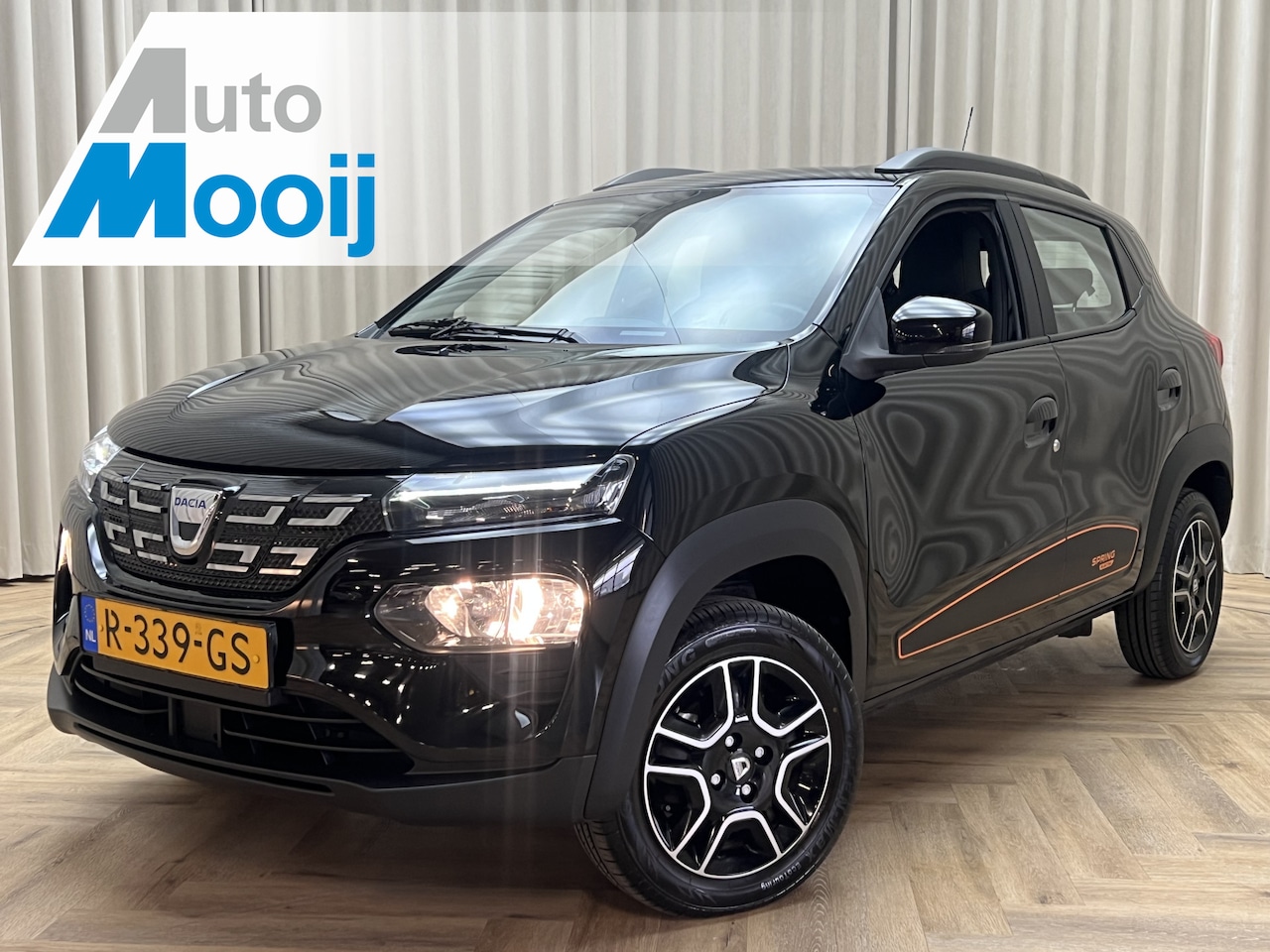 Dacia Spring - Comfort Plus *LEDER* Camera / Navi+CarPlay / Fabrieksgarantie / PDC / 4x Elektr. Ramen, Cr - AutoWereld.nl