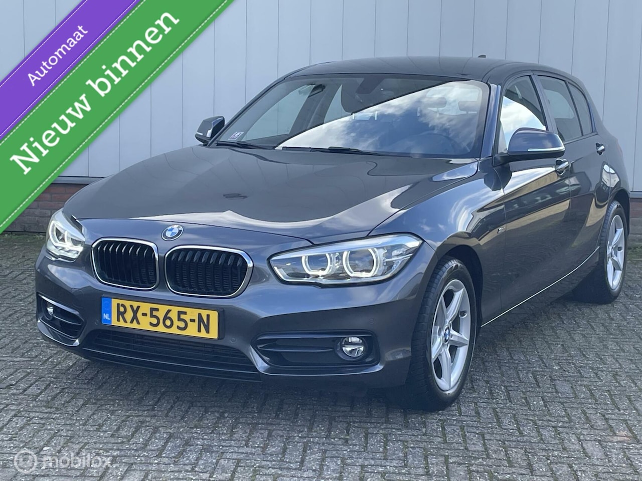 BMW 1-serie - 118i Edition Sport Line Shadow High Executive [ Sport Stoelen/ Grootbeeld Navi/ Harman&Kar - AutoWereld.nl