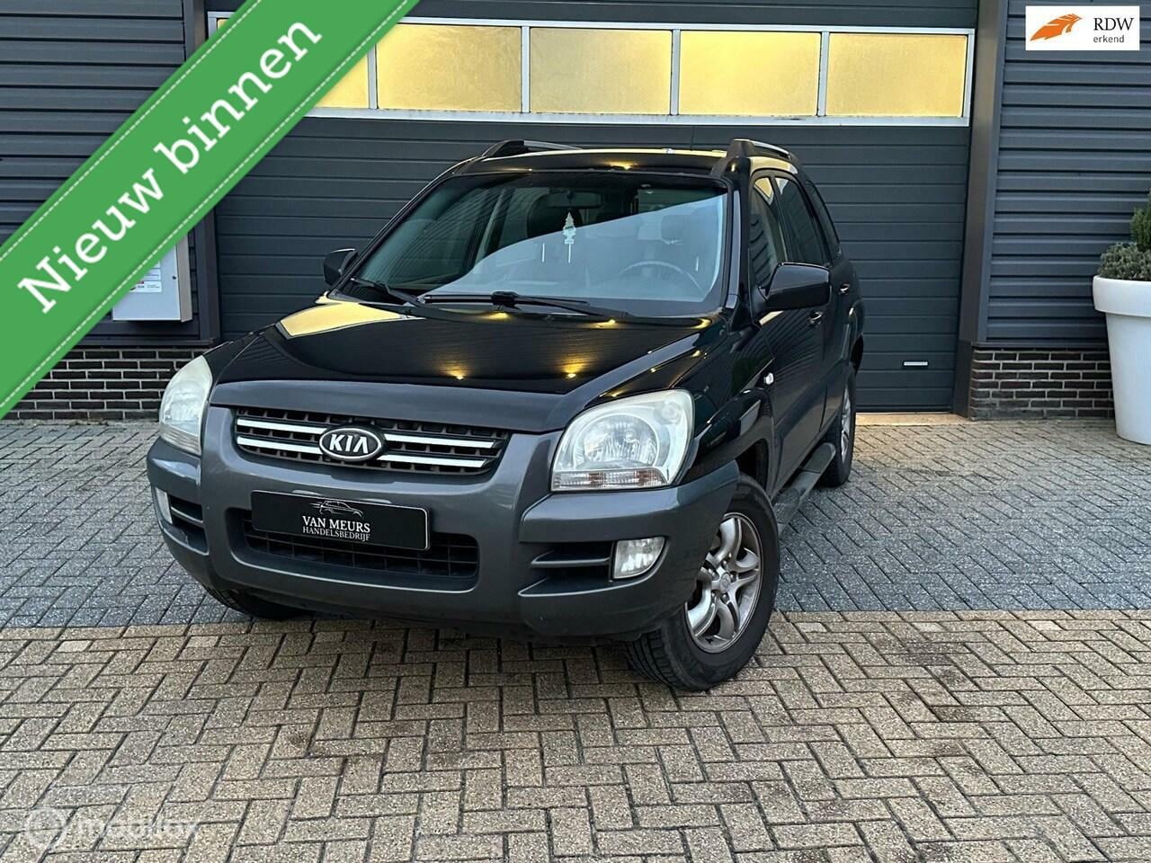 Kia Sportage - 2.0 CVVT X-ecutive 2.0 CVVT X-ecutive, airco, trekhaak, half leder, apk 05-2025 - AutoWereld.nl