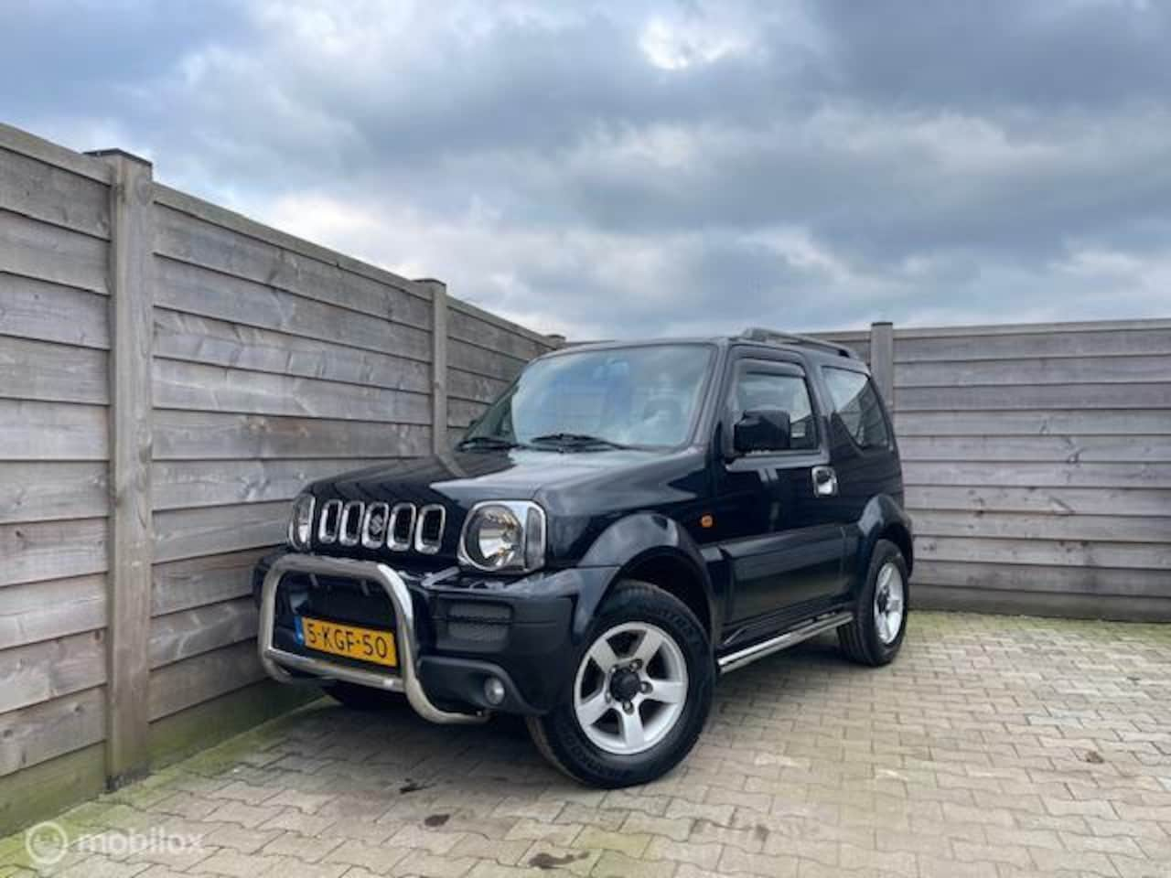 Suzuki Jimny - 1.3 Exclusive AUTOMAAT-AIRCO-4X4 - AutoWereld.nl